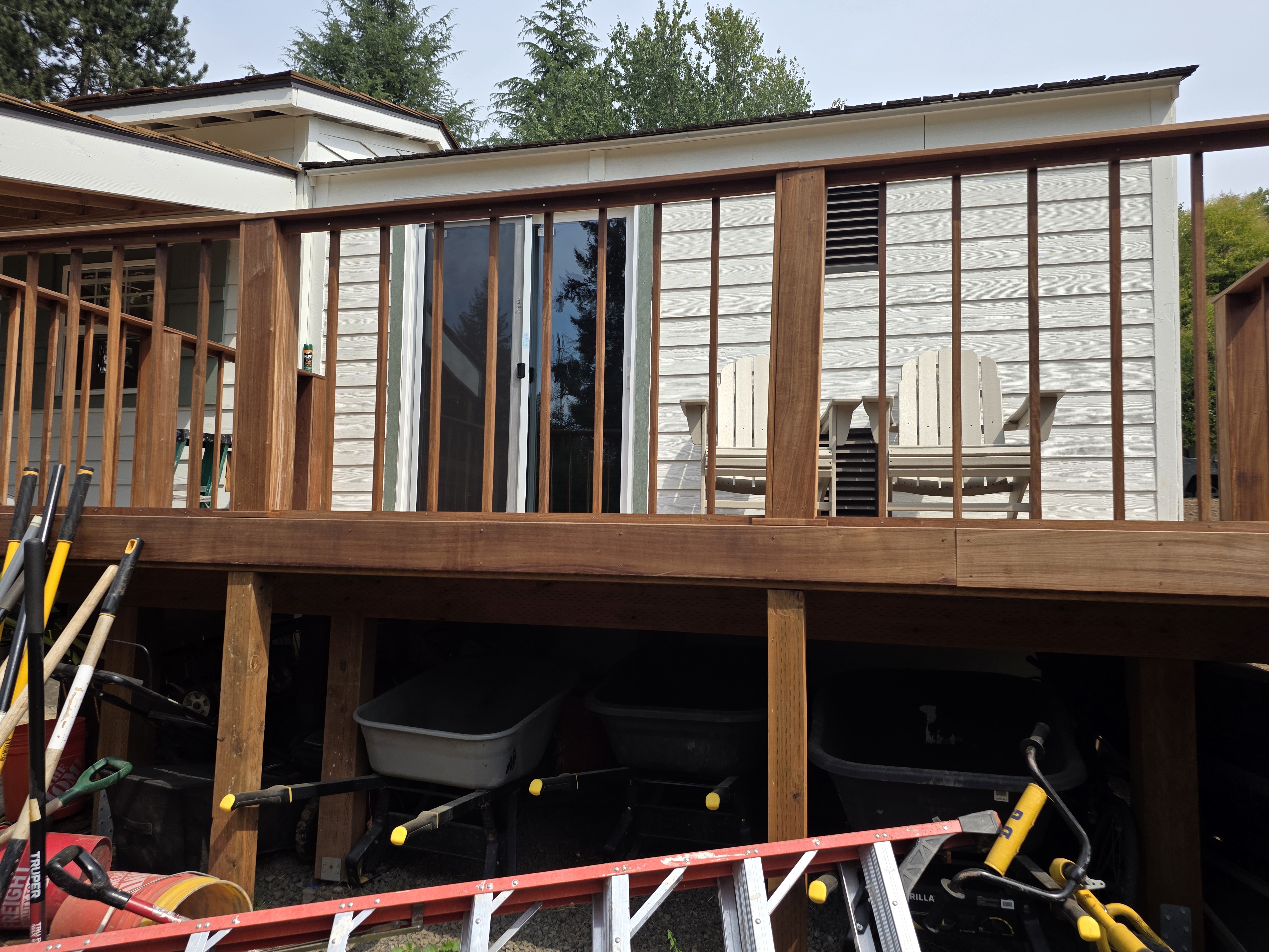 Elevated deck with railing construction
